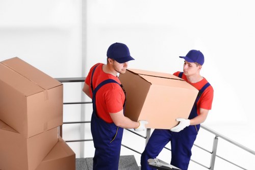 Furniture and boxes being loaded into a van in West London