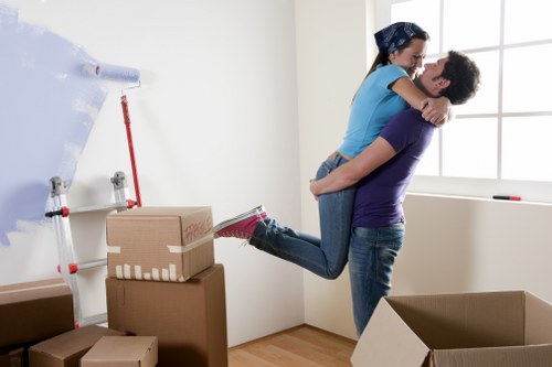 Local movers organising fragile items and boxes in West London