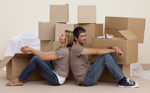 Removal team planning a house move in Ealing with boxes and furniture