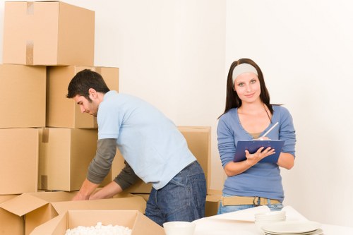 Careful packing and transport of office equipment in West London