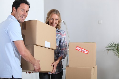 Local movers handling furniture and boxes in West London