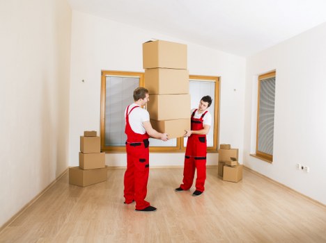 Local Ealing moving service arranging boxes and furniture safely