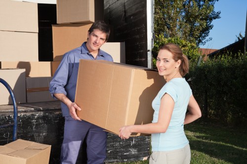 Office furniture and equipment being prepared for a local commercial move